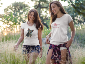 two-girls-wearing-different-t-shirts-mockup-having-fun-while-walking-outdoors-a15315